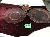 pink depression glass, one has chip