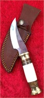 Fixed bladed knife with stacked brass, wood and bo