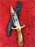 Knife with simulated antler handle, brass guard, e