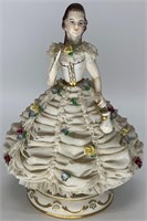 German porcelain figurine of a young woman, has ma