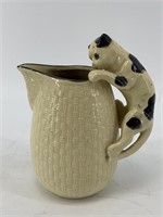 Vintage porcelain creamer/pitcher featuring handle