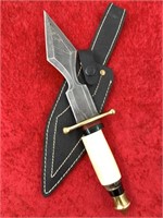 Pattern Damascus bladed dagger with brass cross gu