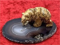 Stone carving of a bear on polished agate slab 3.5