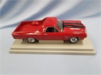Diecast 1970s El Camino with moveable parts on dis