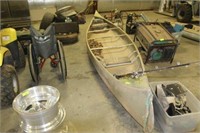 CANOE WITH FISHING RODS AND BOX OF MISC ITEMS