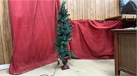 Small Christmas tree with lights. One bulb socket