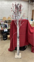Large frosted light up twinkling decorative tree.
