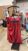 Metal clothing display rack. 75 inches tall