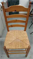 Wooden dining chair with rattan seat