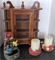 Small hanging cabinet with candles and bird