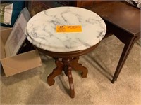 small marble top table with chip 18"t x 14"r