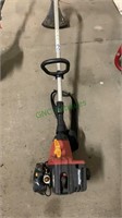 Homelite gas powered trimmer, with string,