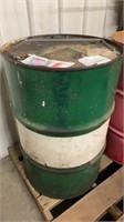 Green and white metal 55 gallon drum, with oil,