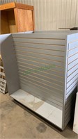 2 silver heavy duty display racks, with a box of