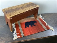 Small Wooden Footstool and Woven Bear Rug