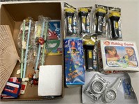Box lot containing toys, flashlights, etc