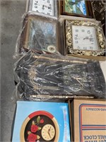 Large box containing a variety of clocks