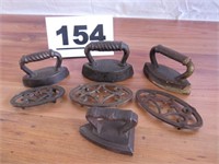 4 EARLY SMALL SAD IRONS TRIVETS