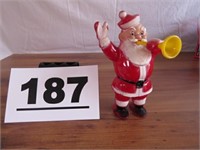 VINTAGE PLASTIC SANTA WITH TRUMPET AND TOY BAG
