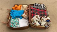 Suitcase with various material and three scarfs