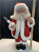 Christmas Santa Stands approx 24” tall 
No