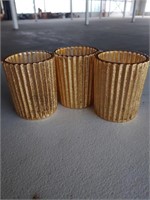 3 gold candle holders