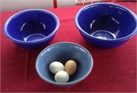 Three blue stoneware bowls