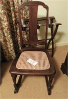 Cane bottom rocking chair and folding luggage