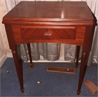 Mahogany sewing cabinet with Singer Sewing