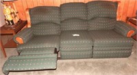 Green upholstered three cushion dual recliner