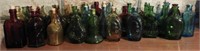 Approximately (35) glass Bitters Bottles in