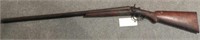 Antique double barrel twelve gauge shotgun with