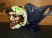 blue creamer glass picher and handle head vase