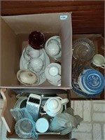 Three boxes of dishes, glasses and kitchen ware.