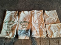 Four Alfalfa feed bags.