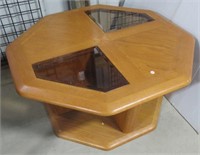 Oak coffee table with beveled glass panels.