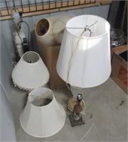Assortment of lamps and lampshades.