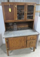 Antique kitchen cupboard with a set of glass