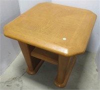 Oak end table. Measures 22" H x 26" W x 24" D.