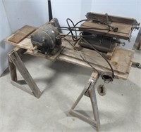 Vintage table saw with wood saw horses.