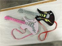 Pair of electronic toy guitars
