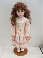 Vintage 28" porcelain doll on wooden stand