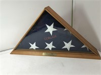Folded American flag in case