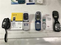 Two Sprint flip phones with case and manual