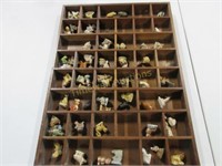 Wade figurines in wooden shelf and more