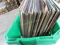 Green bin full of vinyl records