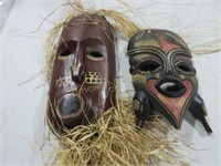 Two carved wooden tribal masks