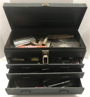 Green metal tool box with tools