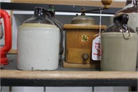 THREE SMALL GLASS JUGS WITH WOODEN GRINDER