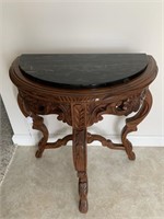 Half round table w/marble top.